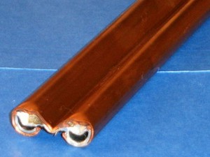 Roll formed copper and galvanized conductor bar. -Image