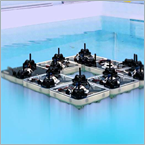 Swarm of aquatic robots assembles into shape-shifting structures on water