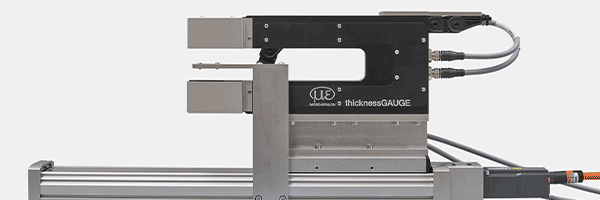 Inline thickness monitoring of strip and plate materials